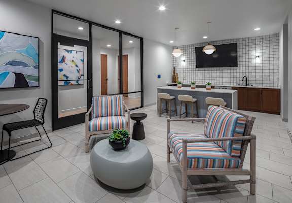 a living room with two chairs and a table  at 2929 on Mayfair, Wauwatosa, WI