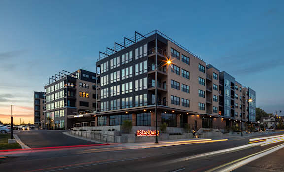 a large building with a street in front of it at night