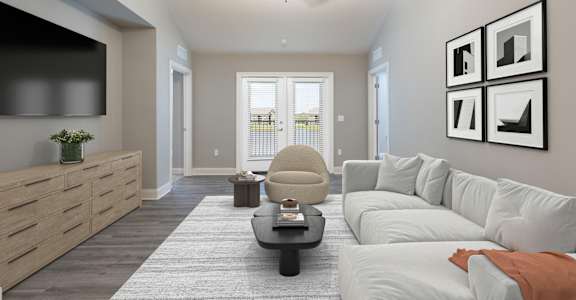 a living room with a white couch and a ceiling fan