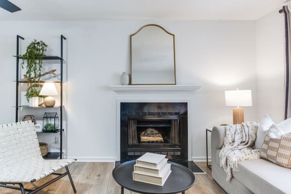 a living room with a fireplace and a white couch