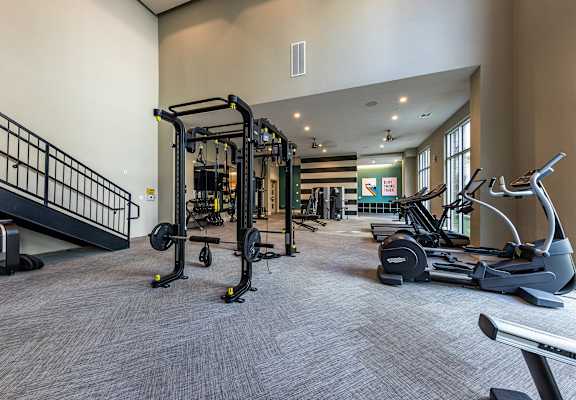 spacious gym with cardio equipment at The Monroe Apartments, Austin, 78741