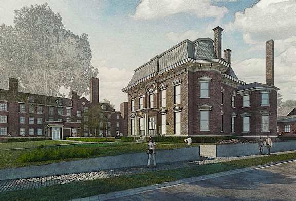 A large red brick building with a green lawn in front.