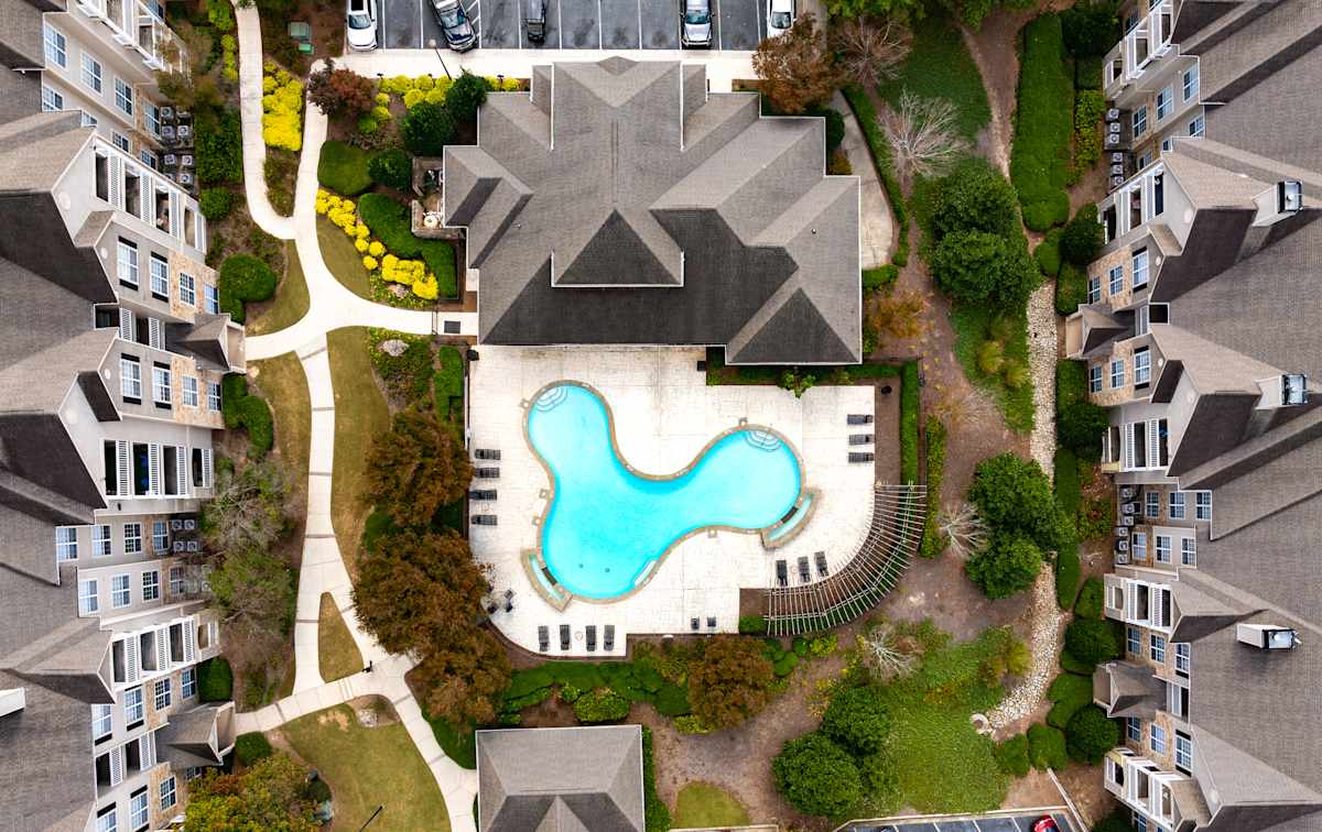 Community grounds and parking at Wesley Stonecrest Apartments - Stonecrest, GA