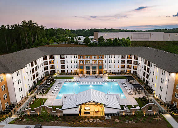 A large building with a pool in the middle of it.
