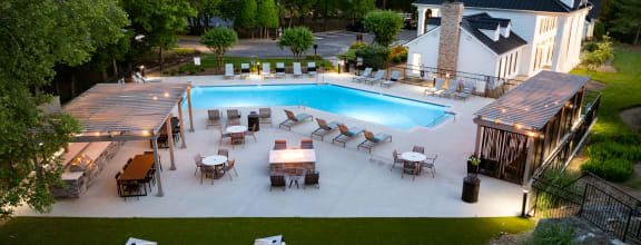 Aerial view of swimming pool and chairs at Ashton Brook pet-friendly apartments in Franklin, TN