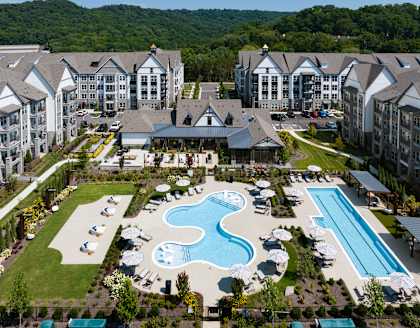 an aerial view of the resort with a swimming pool