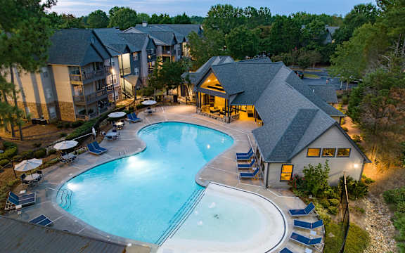 an aerial view of a swimming pool at night