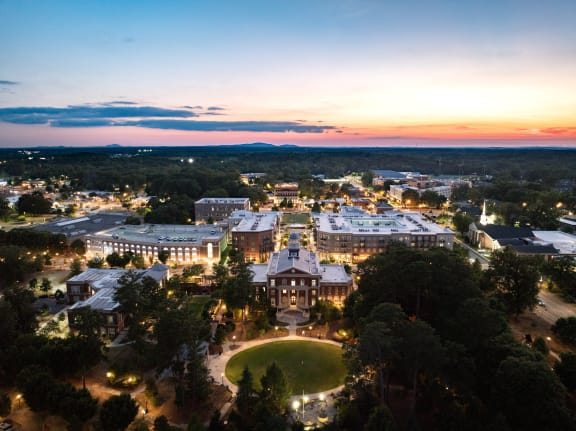 an aerial view of the campus at dusk