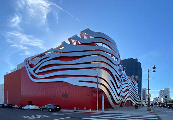 A large red building with a white and red striped design.