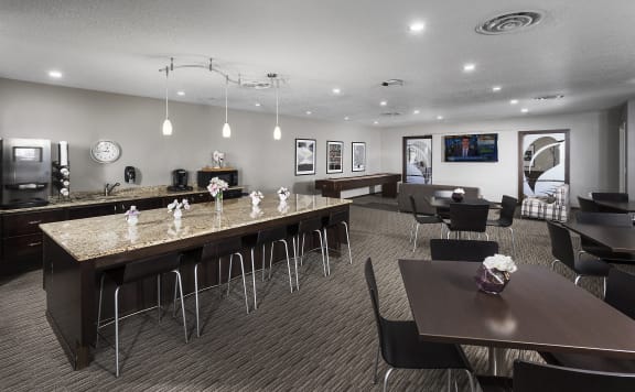 community room with large island and tables for seasing