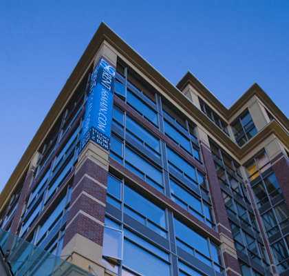 A modern building with a glass facade and a large atrium.