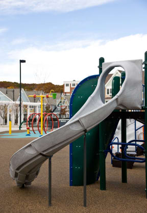a slide at a playground in a park