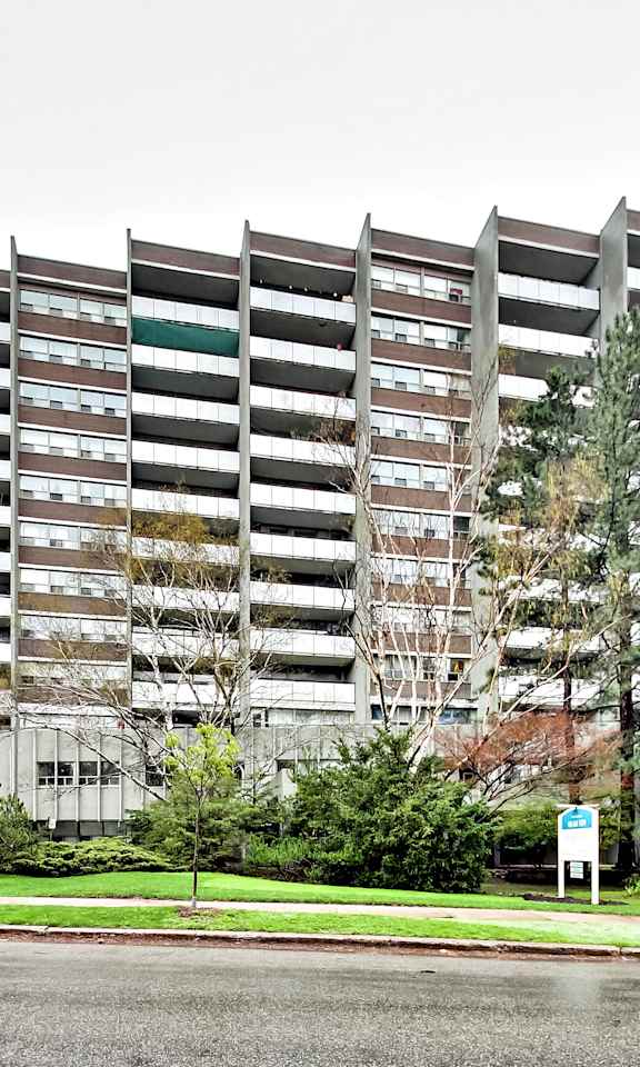an apartment building on the corner of a street