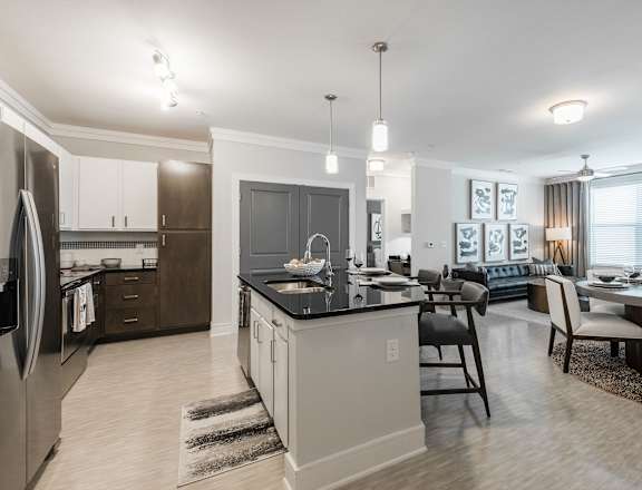 a kitchen and dining area in a 555 waverly unit