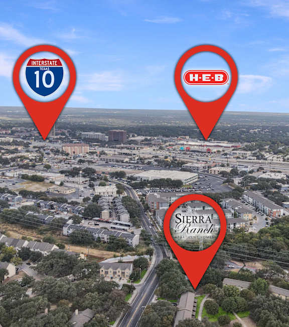 An aerial view of a city with markers for Interstate 10, H-E-B, and Sierra Ranch.