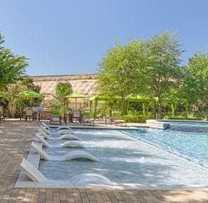 a swimming pool with a bunch of chairs in it