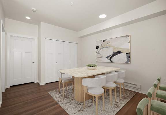 A dining room with a table and chairs.