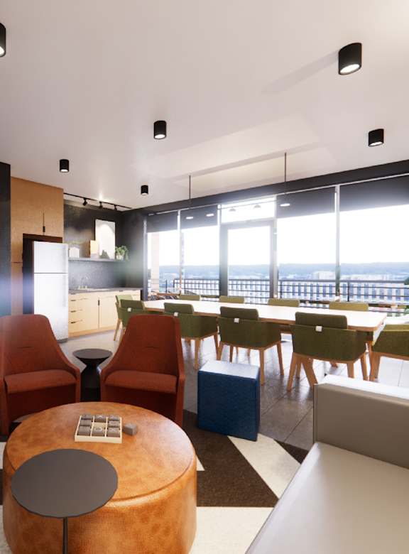 A modern living room with a large window and a variety of seating options.