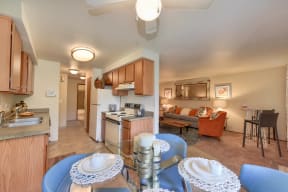 Kitchen with View of Living Room, Wood Cabinets, Oven and Stove