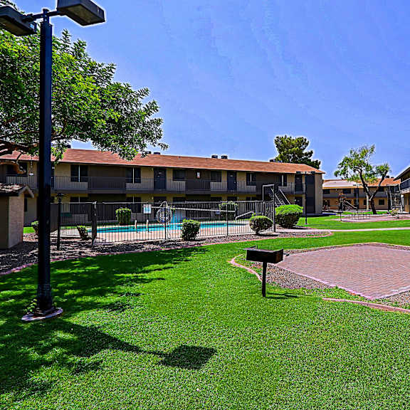 A sunny day at the apartment complex with a clear blue sky.