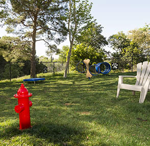 a red fire hydrant sitting in the grass at KIRKER CREEK, Pittsburg, CA, 94565