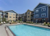 Thumbnail 23 of 26 - pool with seating located in the middle of the apartment properties