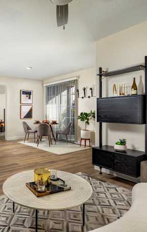 A modern living room with a brown leather chair and a coffee table.