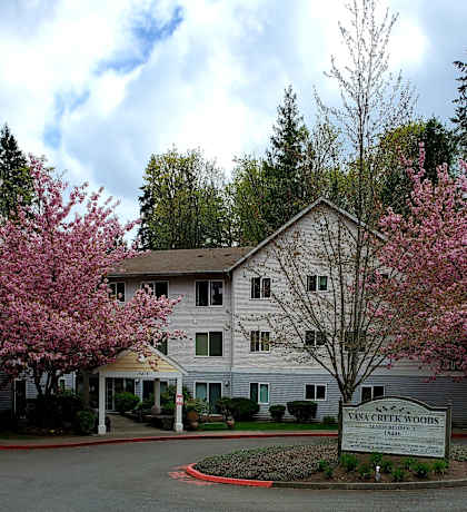 a large white building with a sign in front of it