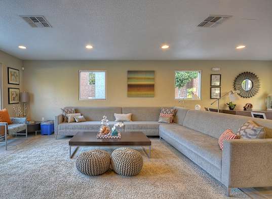 a living room with couches and a coffee table