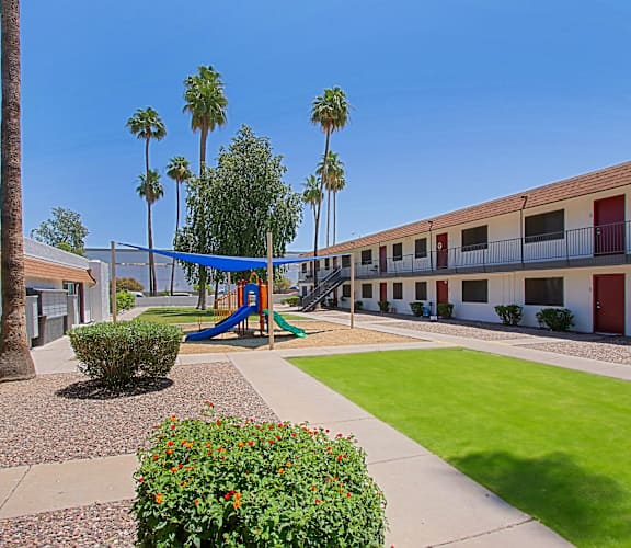 Playground with green lawn at Aspire Mesa,  Arizona, 85210.