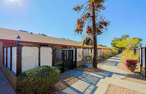 A sunny day at a residential area with a clear blue sky.