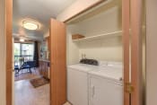 Thumbnail 8 of 15 - In Unit Washer and Dryer, Wood Cabinets, Shelves and View of Dining Room