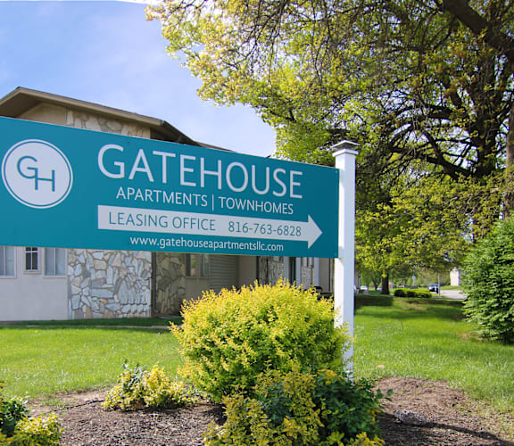 the gatehouse apartments sign in front of a building at Gatehouse Apartments, Kansas City