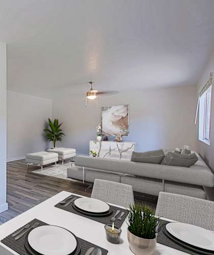 A modern kitchen with a dining table set for two at Aspire Mesa,  Arizona.