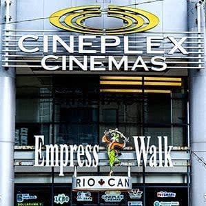 a movie theater sign on the front of a building