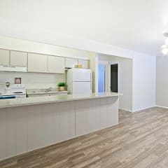 a kitchen and living room in a 555 waverly unit