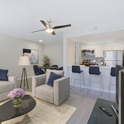 a living room with a couch chairs and a coffee table