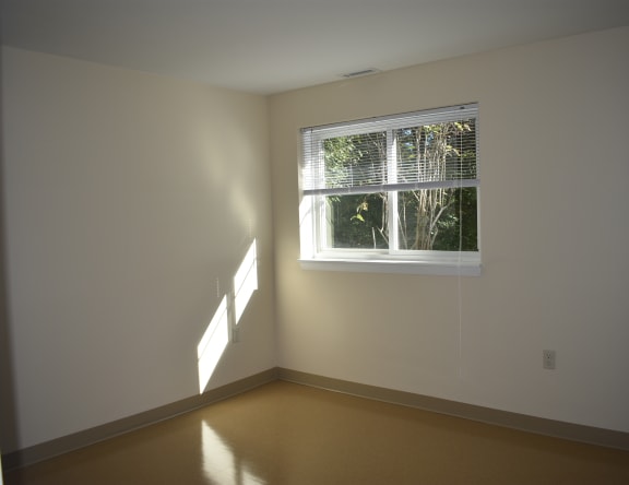 an empty room with a window in it