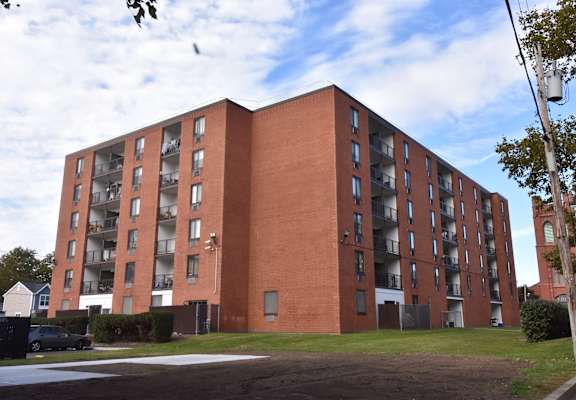 an apartment building on the corner of a street
