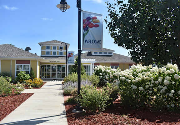 a welcome sign in front of a building