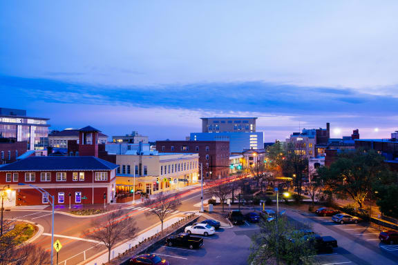 an aerial view of a city street at night at Viceroy Apartments, North Carolina, 27707