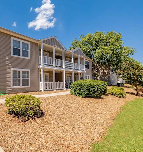 an open kitchen and dining area with a marble counter top at Sanctuary Apartments & Townhomes, Augusta