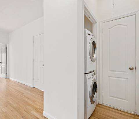 A laundry room with a washer and dryer in it.