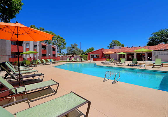 our apartments offer a swimming pool with umbrellas at Spring Meadow Apartments, Glendale, AZ, 85302