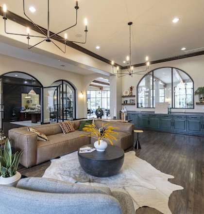 a living room with couches and chairs and a table