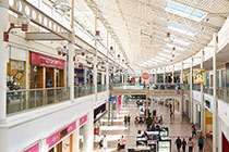 Shopping mall with people walking around.