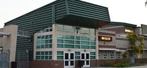 A building with a green roof and a sign that says "MARSHALL".
