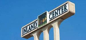 A signpost with the words "Inland Center" on it.