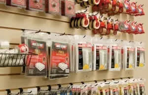 A wall of packaged products are on display.