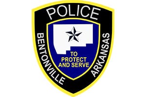 A police badge for Bentonville, Arkansas, with a star in the center.